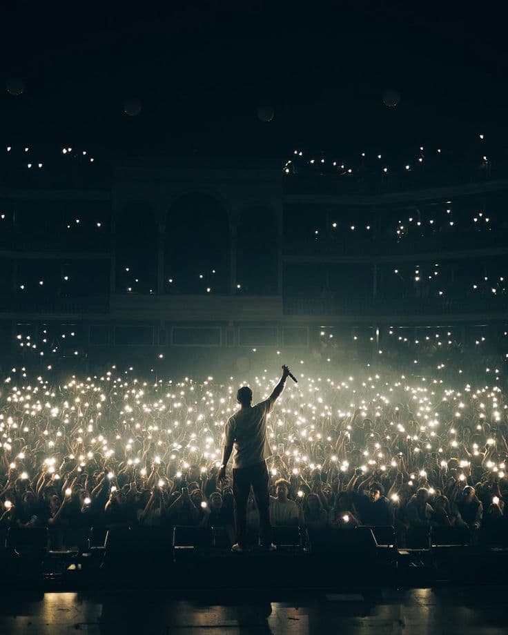 Musician performing on stage managing bookings with Gigbook